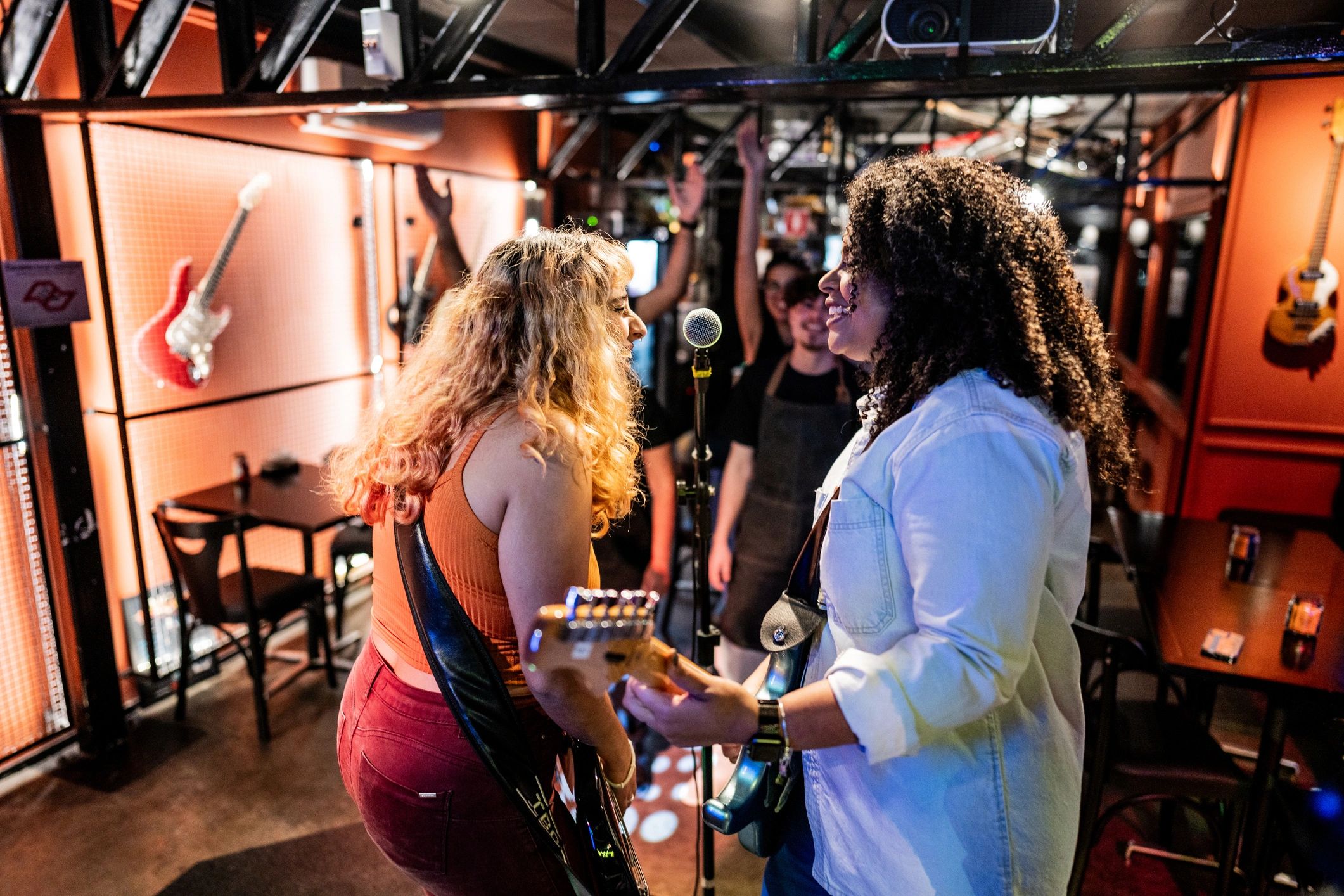 Musicians singing and playing in a pub