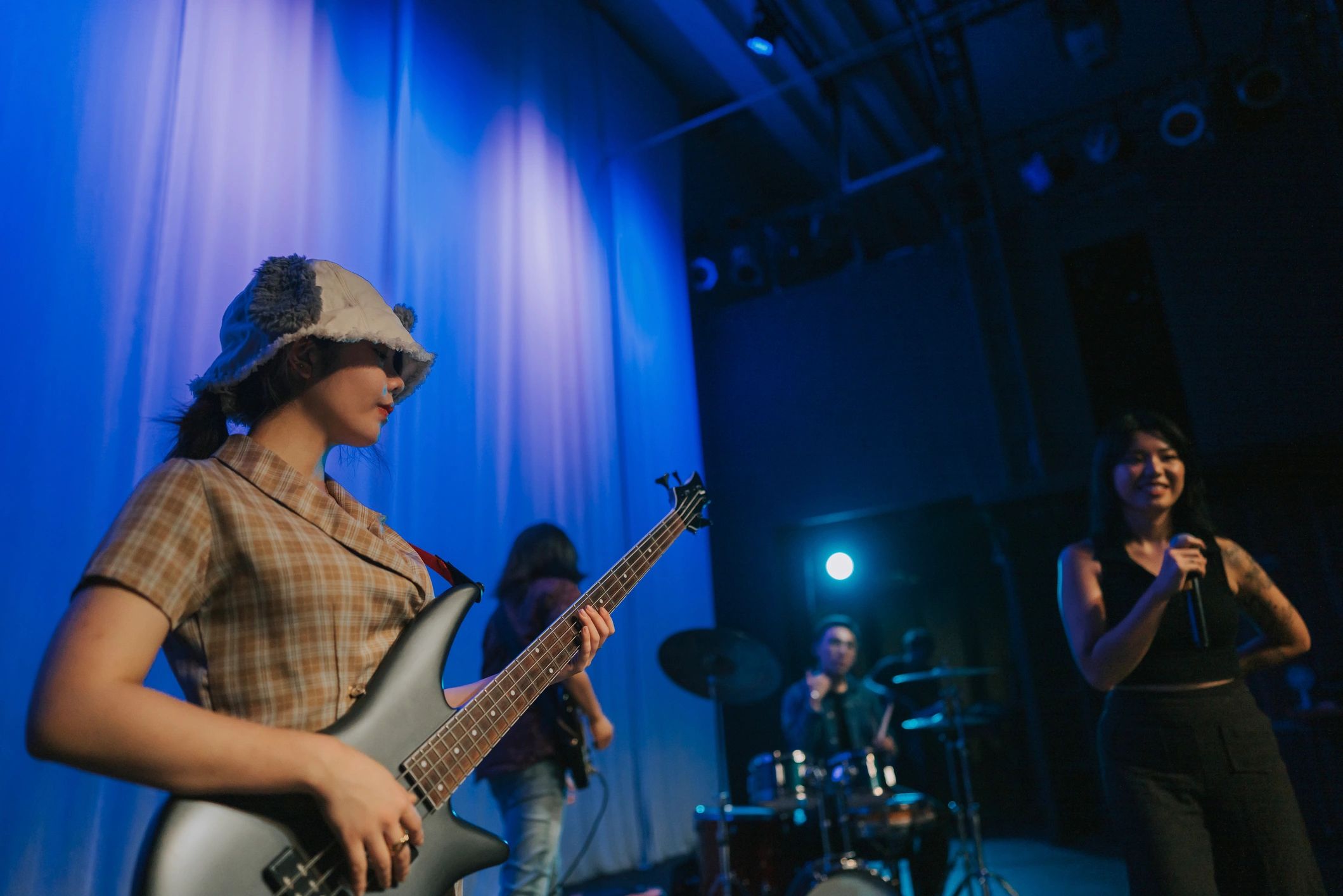 Guitarist performing live under stage lights