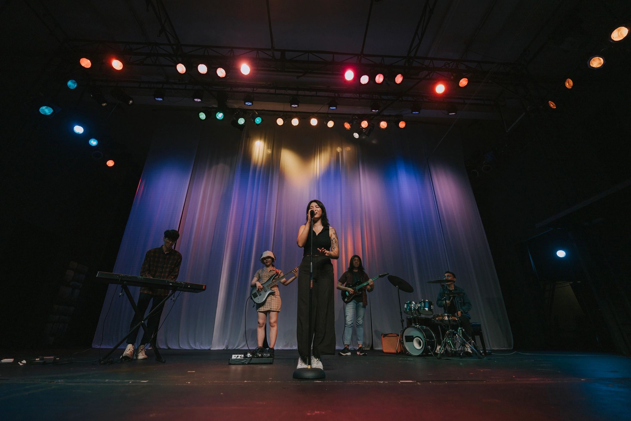 Band performing together on stage